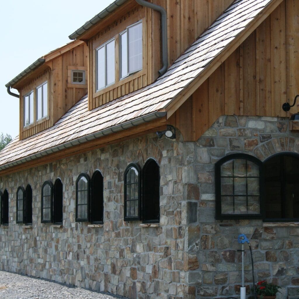 Barn exterior featuring natural thin veneer stone siding supplied by Brandywine Quarry
