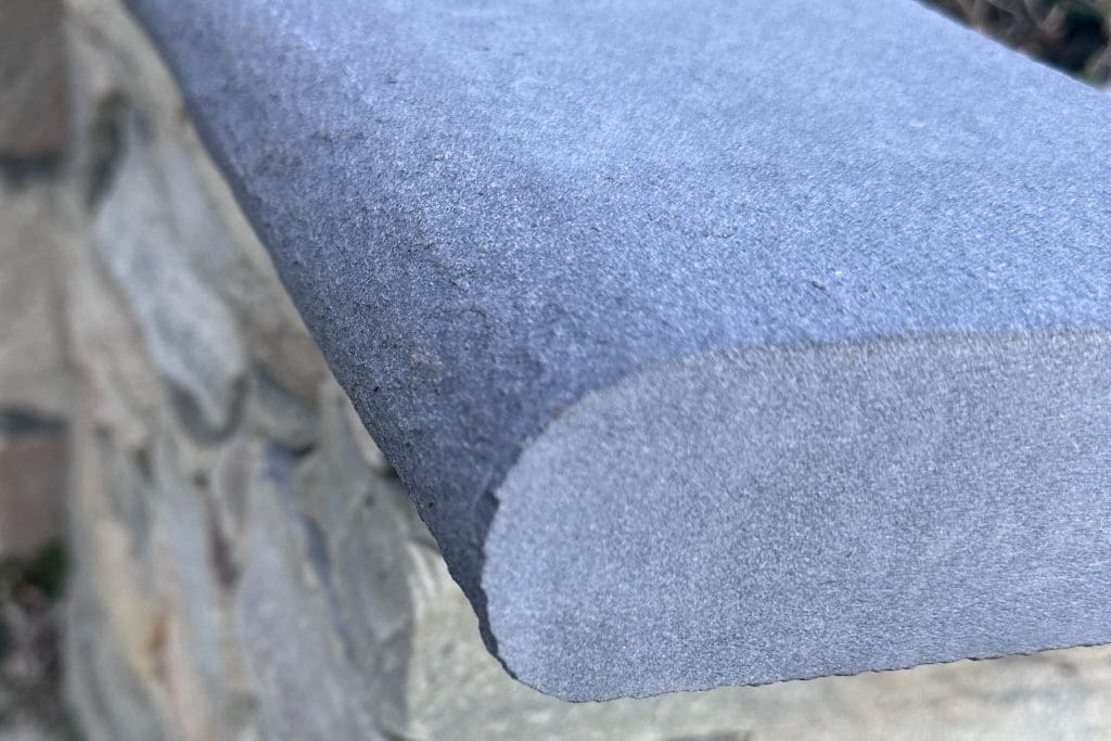 A close-up of bull-nosed bluestone.