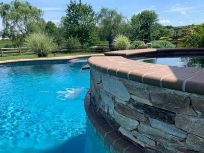 A pool with different levels and natural stone