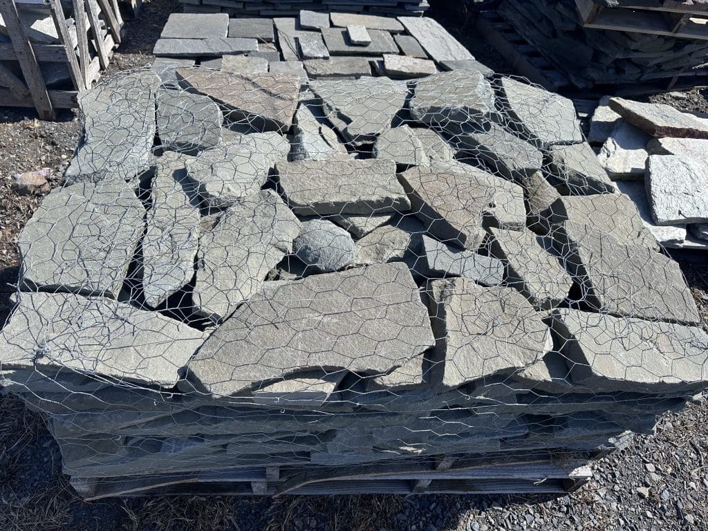 Close-up of handcrafted thin veneer stone masonry highlighting natural texture and color variation